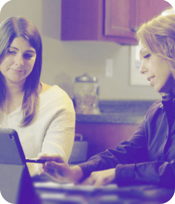 Guardian employee sitting at a table with a customer to review security options