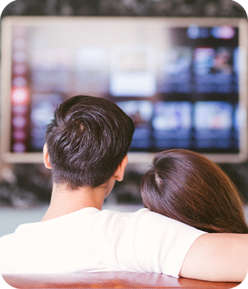 Couple watching TV on couch