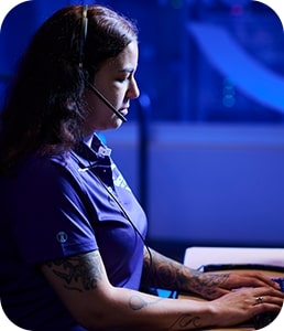 Woman in Guardian Protection monitoring center