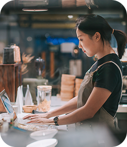 Restaurant employee using computer at work